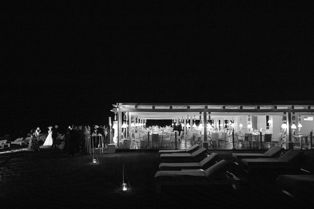 A black and white photograph of the Cala Masciola Beach Club before a wedding reception. 