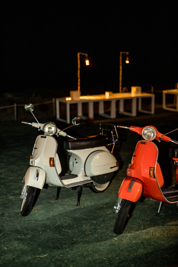Italian scooters line the property at a wedding reception at Cala Masciola Beach Club. 
