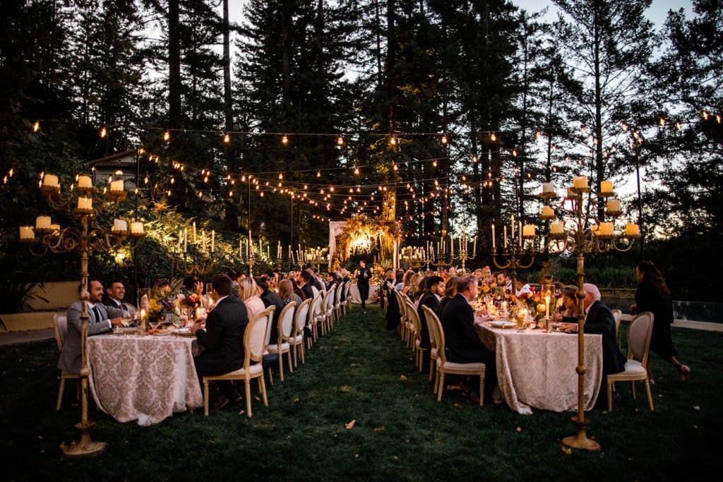 Ambient lighting surrounds a wedding reception in Napa Valley. 