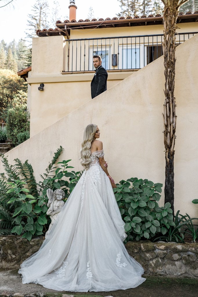 A bride and groom pose for portraits together at their Napa Valley wedding. 