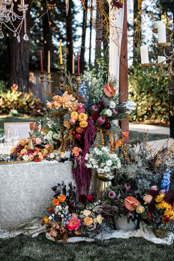 A massive floral installation is created at the sweetheart table during the Napa Valley wedding reception. 