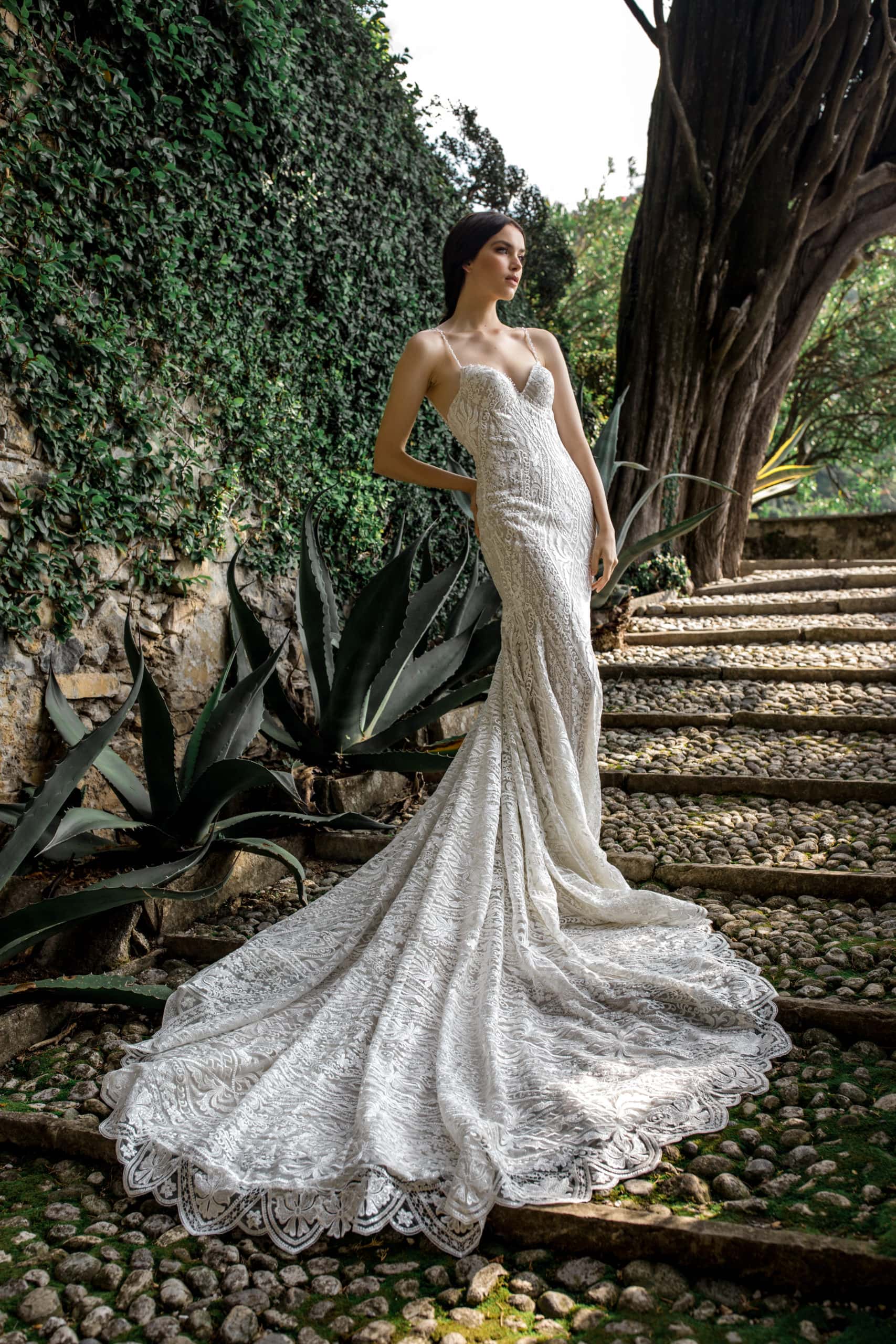 Lace bridal gown train on steps of Villa Cipressi