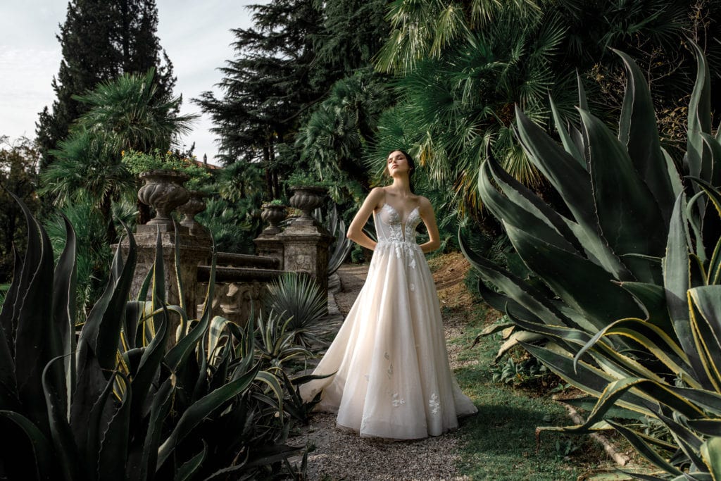 Model wears bridal gown among Lake Como foliage
