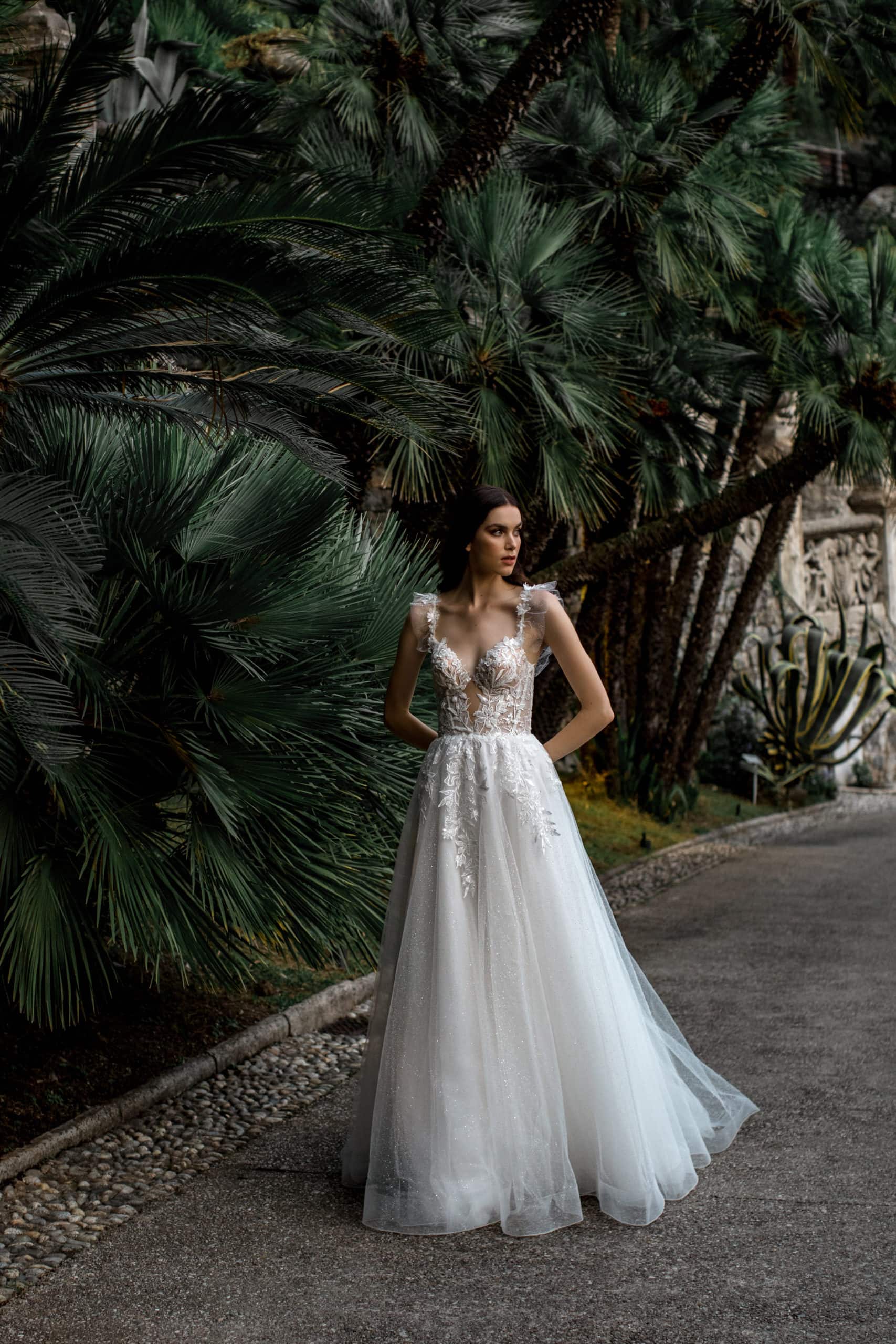 Model walks in bridal gown with full tulle skirt
