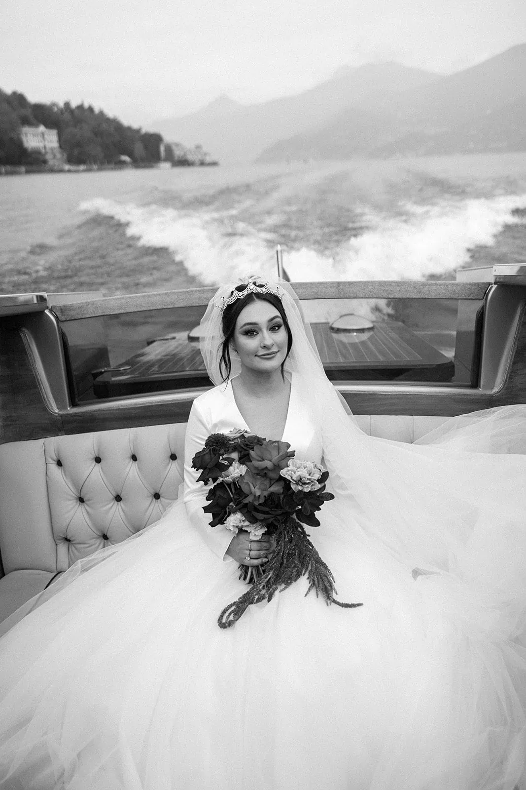 Bridal portrait on classic Italian boat on Lake Como