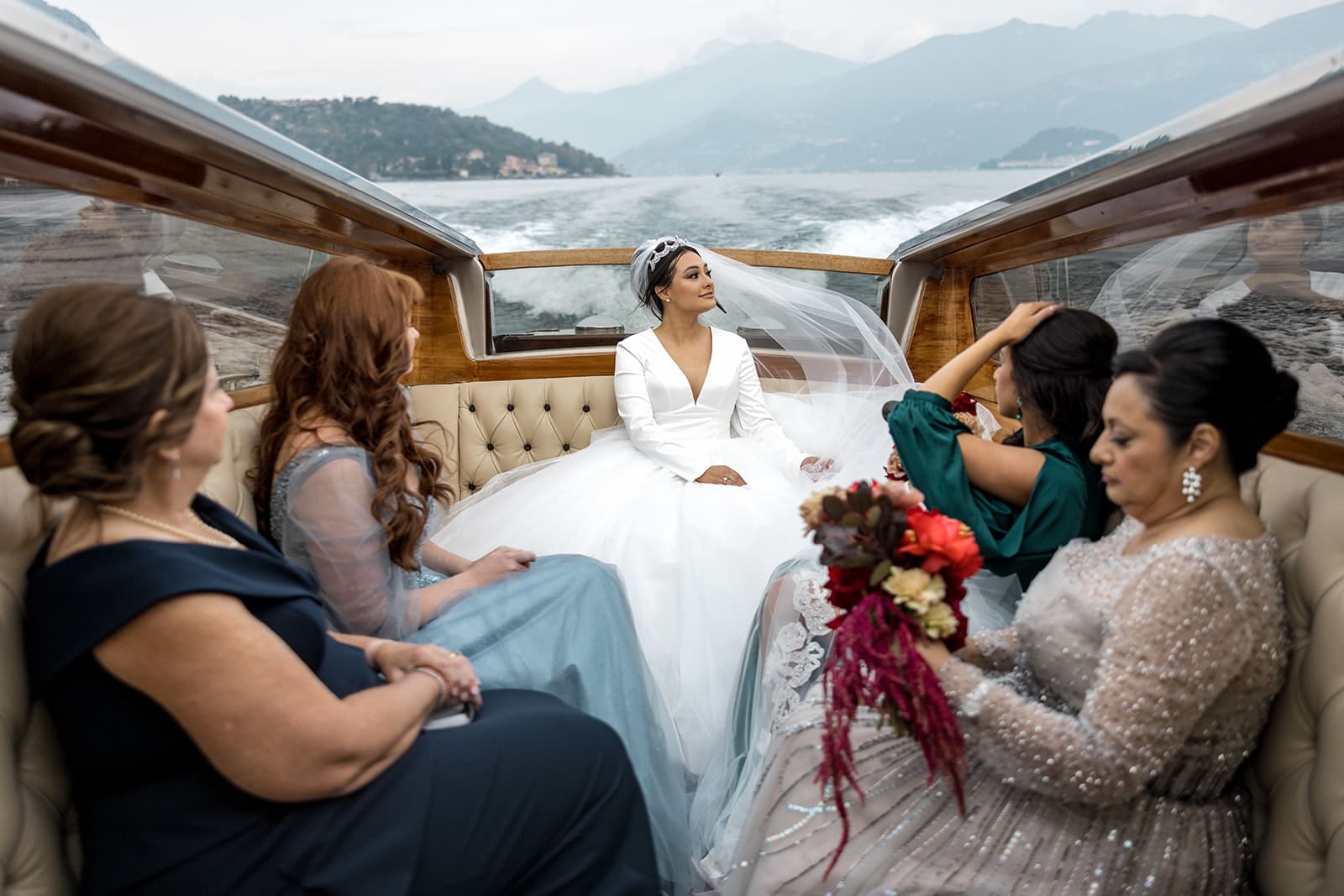 Bride and bridesmaids on boat on Lake Como