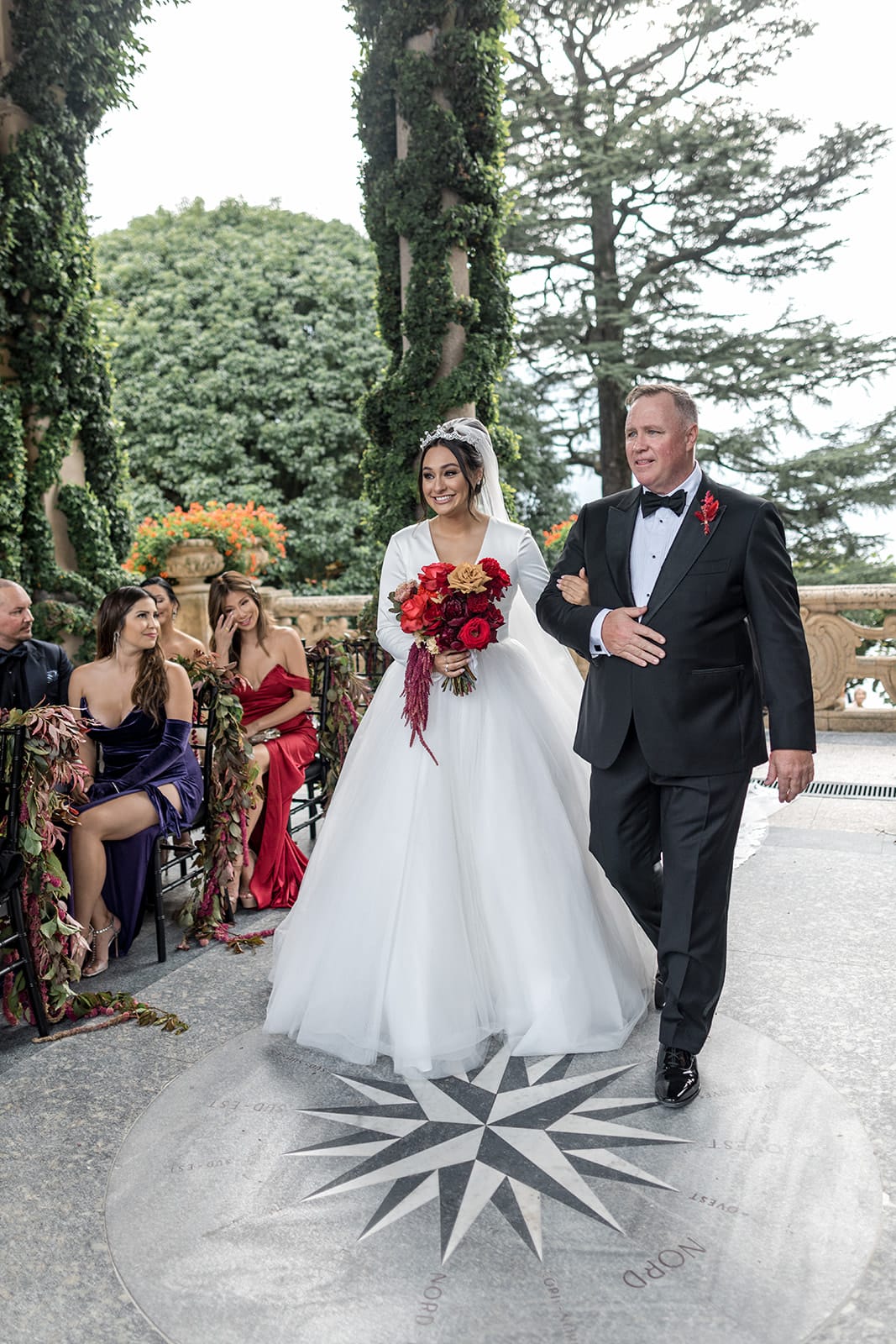 Father walks bride down wedding ceremony aisle at Villa del Balbianello