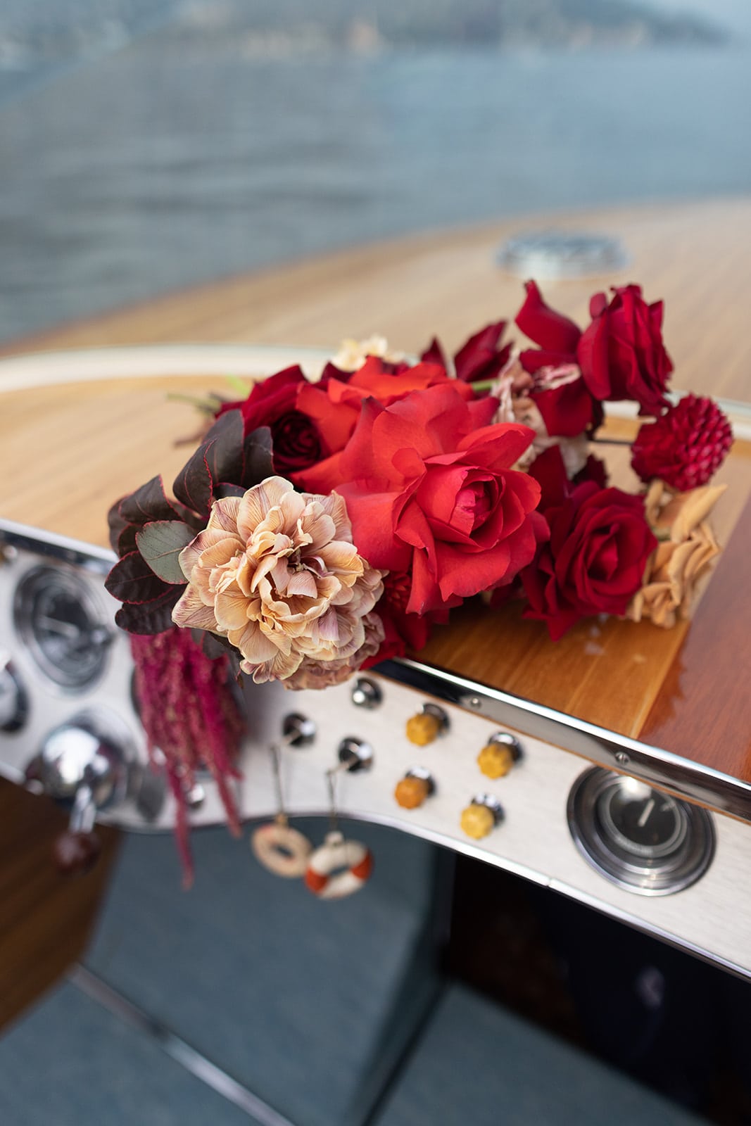Burgundy bridal bouquet on Lake Como boat