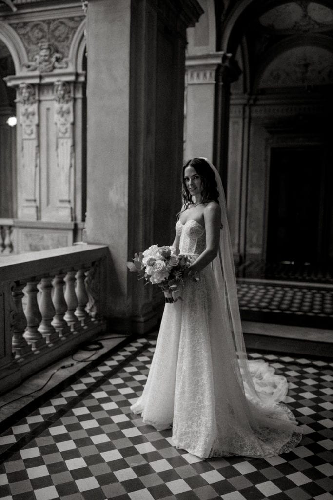 Bride stands in halls of wedding venue before first look