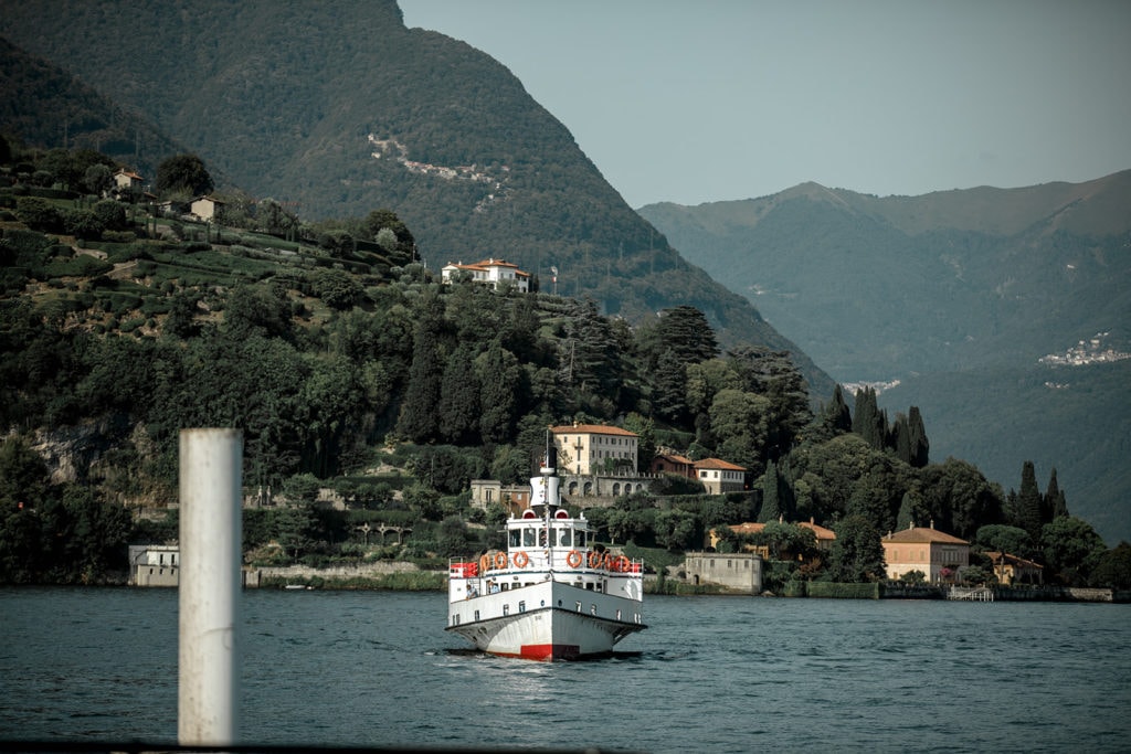 Boat arrives at dock on Lake Como. 