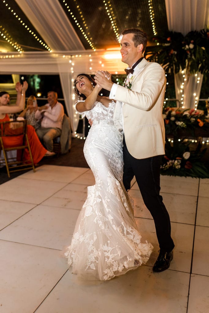 A bride and groom dance during their wedding reception