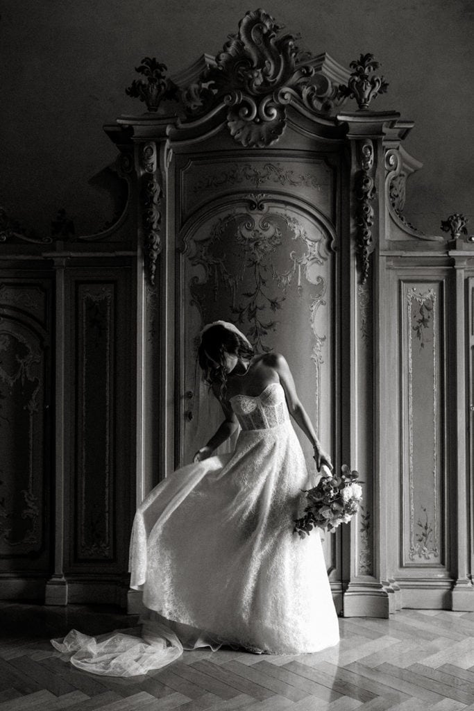 Bride dances in ornate halls of Italian wedding venue