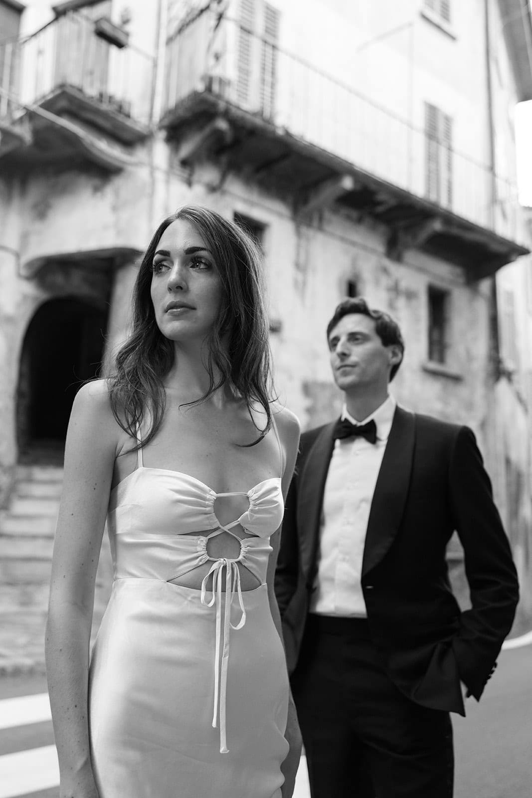 Bride and groom stand together in the streets of Italy