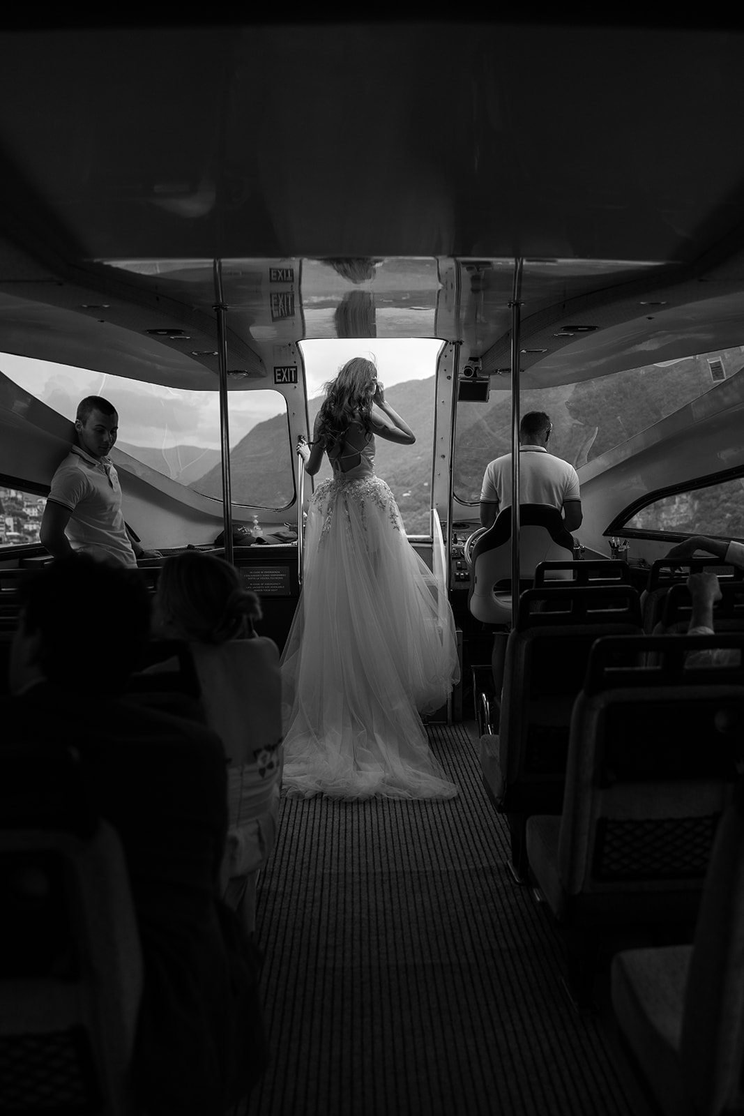 Bride wears Berta overskirt on a boat on Lake Como