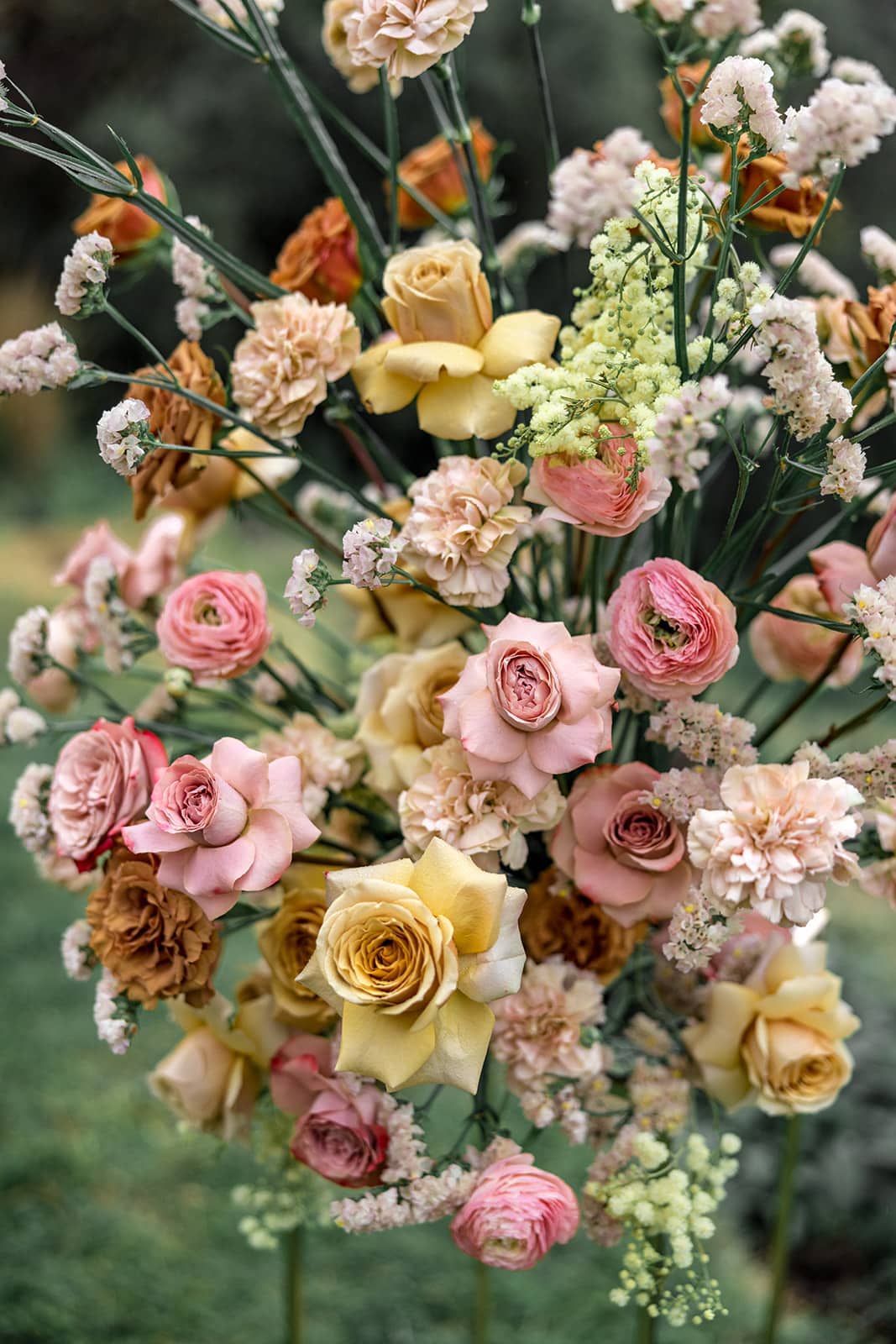 Bright flower arrangement serves as ceremony decor