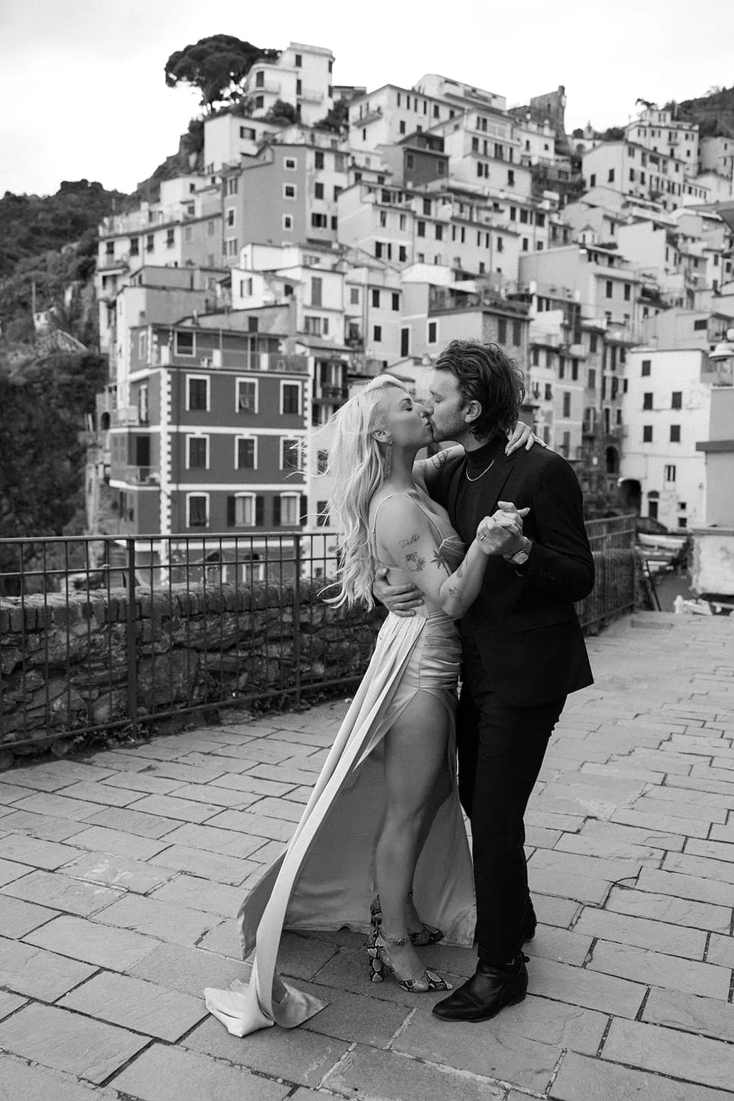 Newly married couple kiss in Cinque Terre