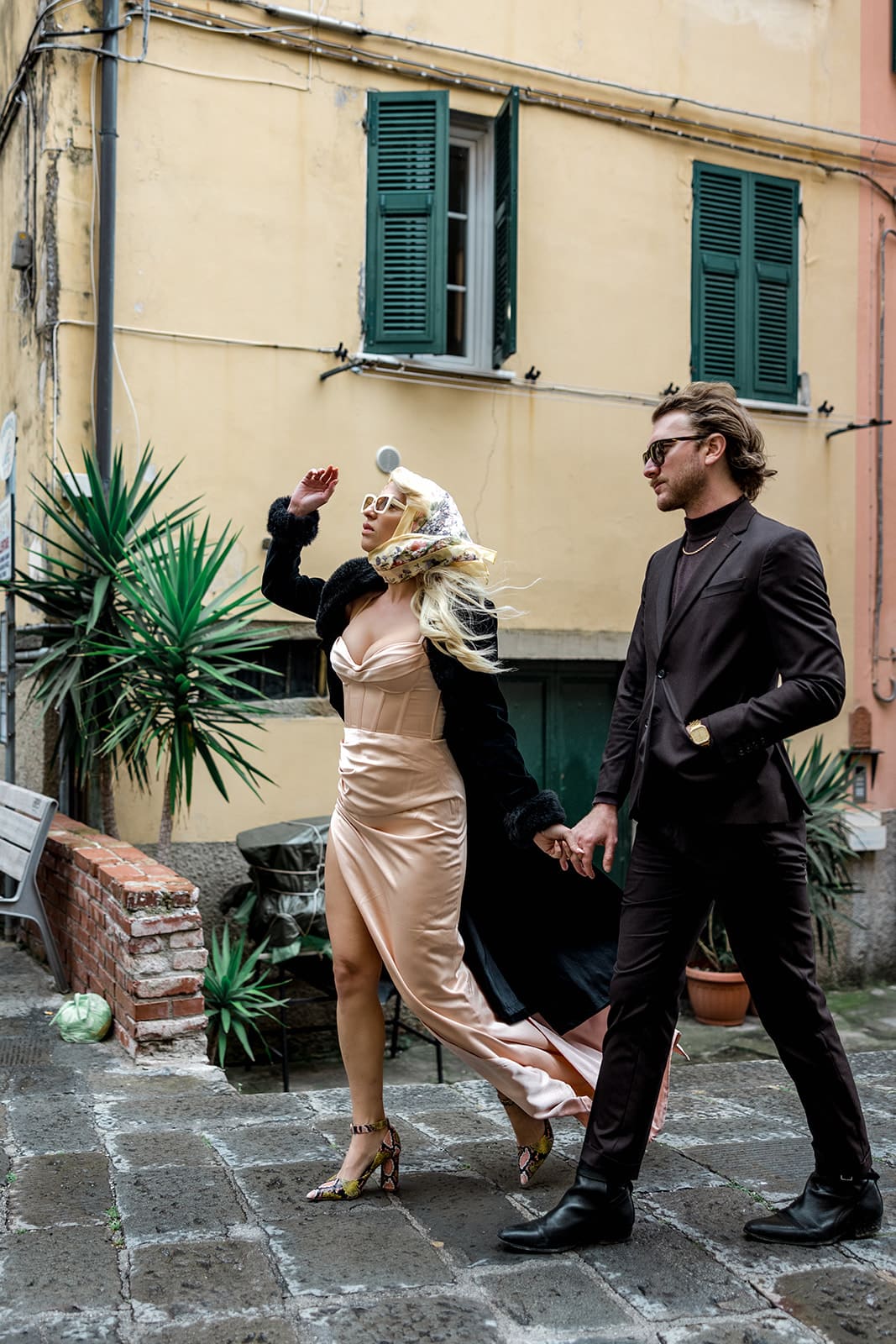 Couple walk down streets of Cinque Terre