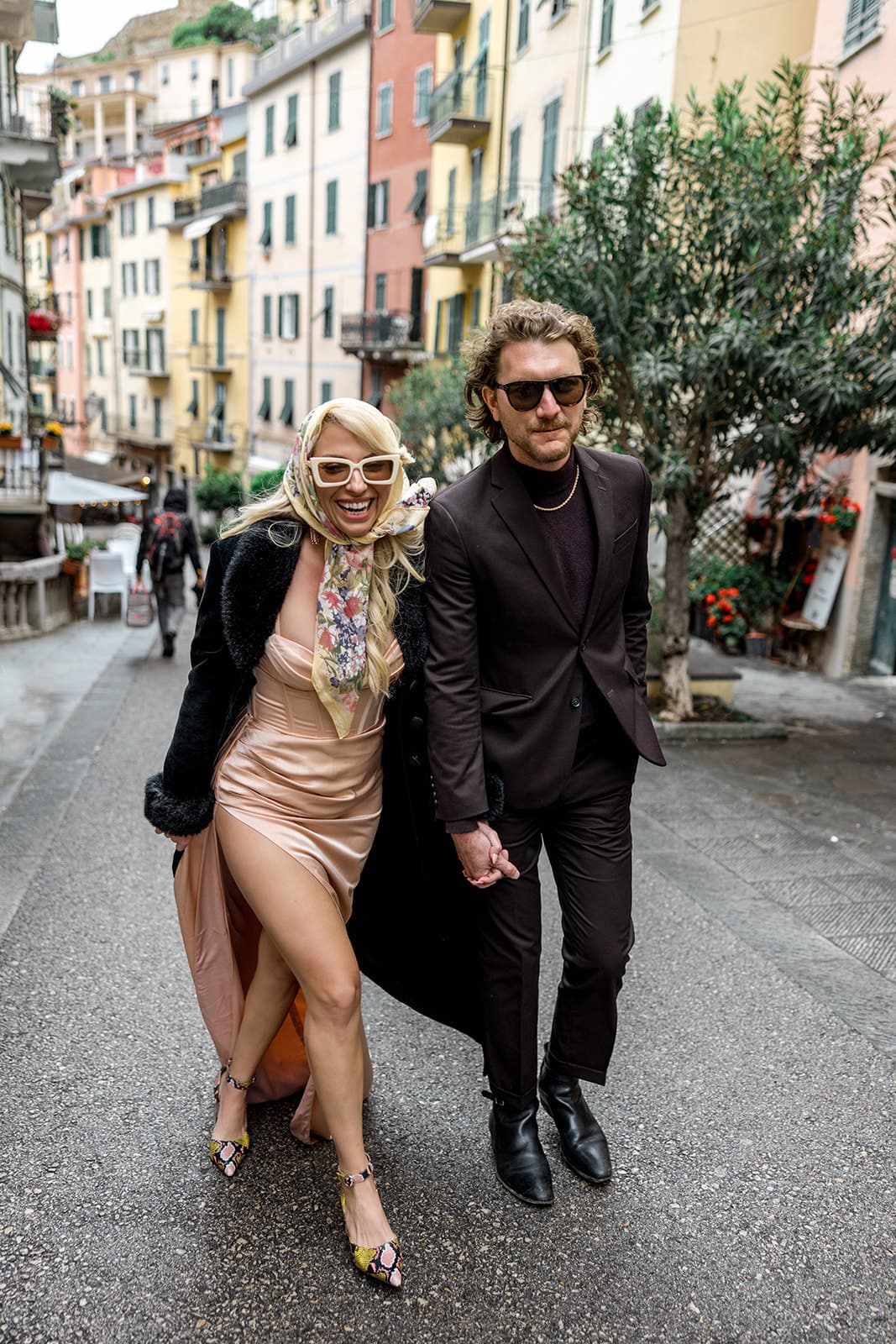 Vintage-inspired couple walk down streets of Cinque Terre