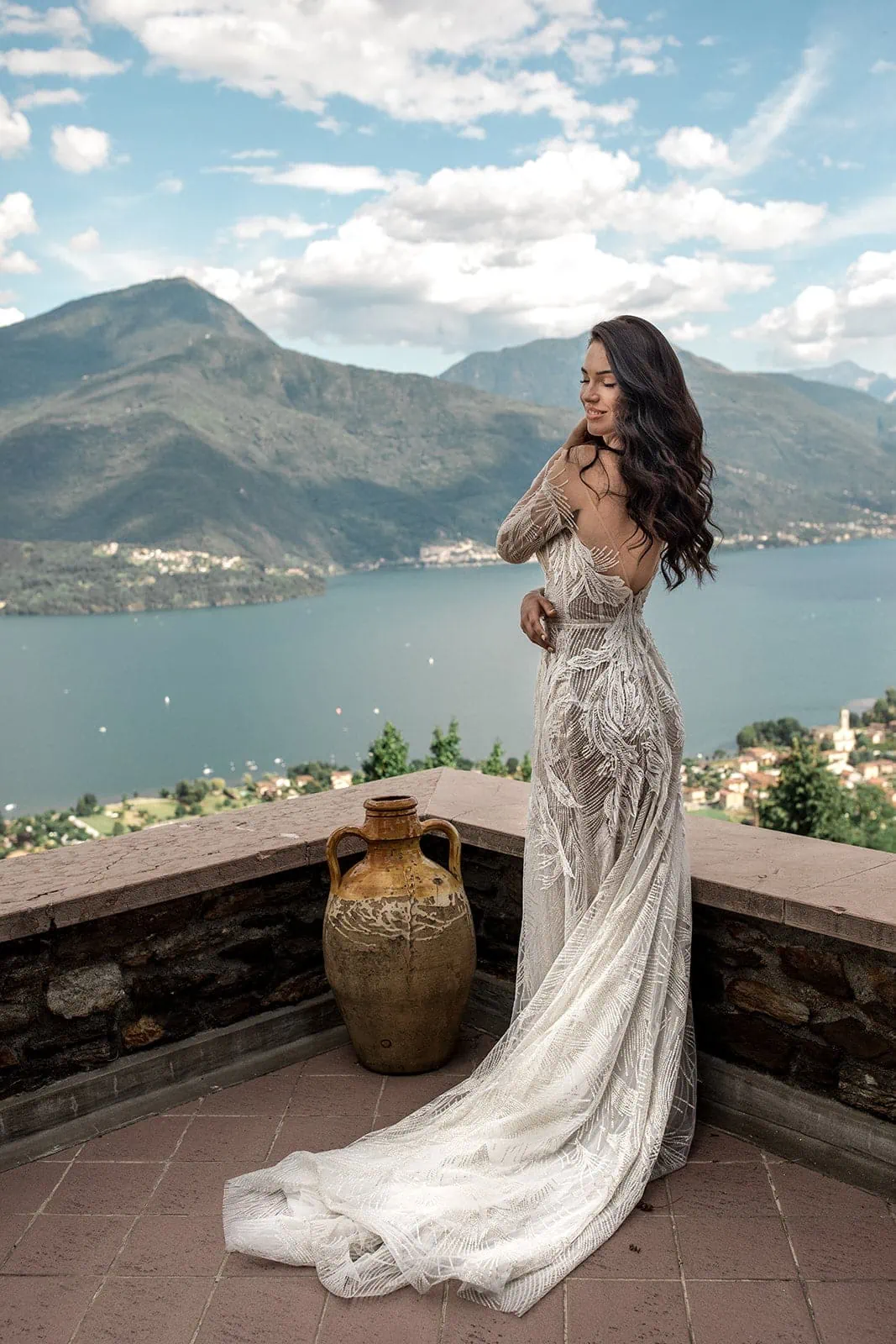 Bride stands overlooking Lake Como