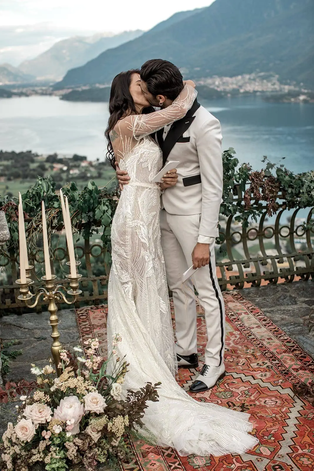 Bride and groom kiss during vow renewal, Italy