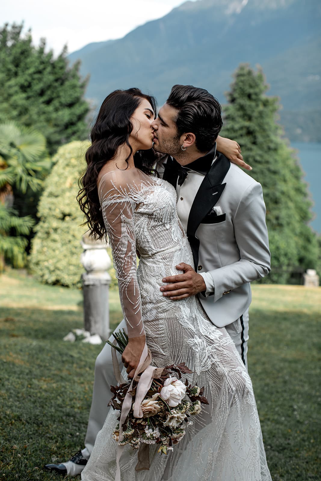 Groom kisses bride during intimate vow renewal celebration