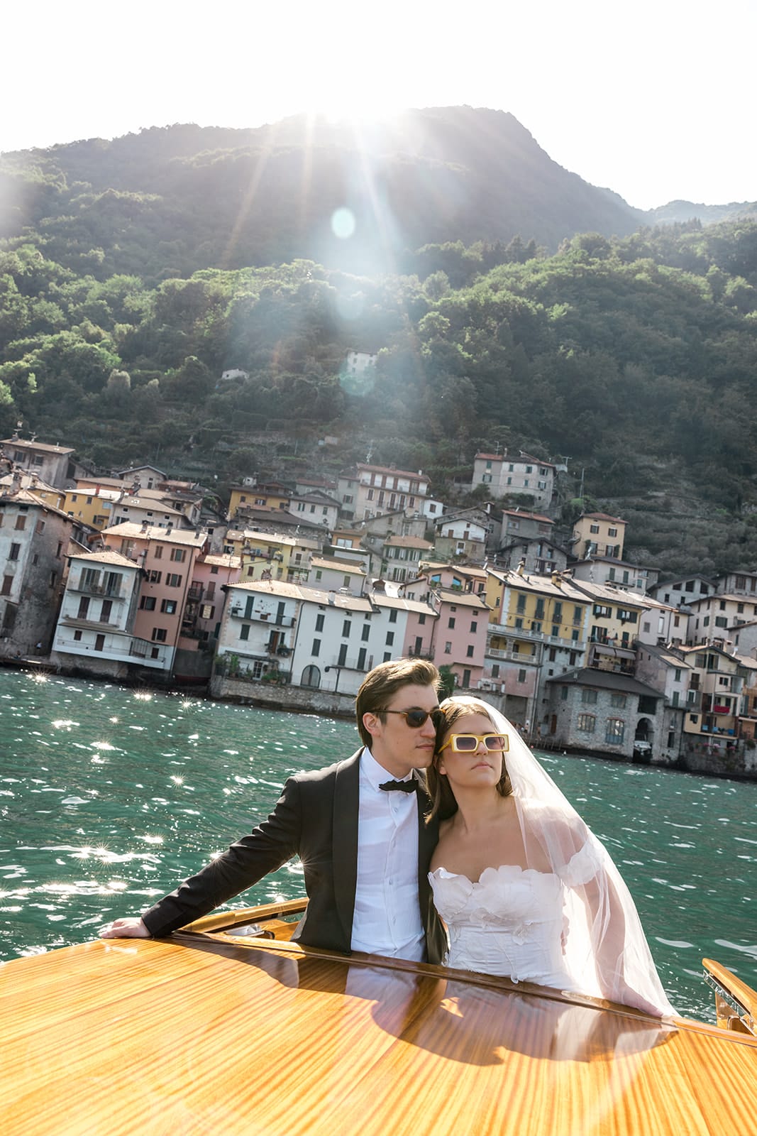 Bride and groom take classic riva on Lake Como