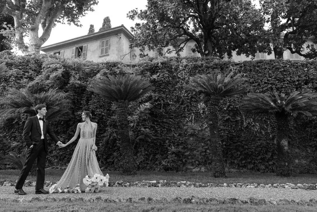 Bride and groom walk the Villa Pizzo grounds