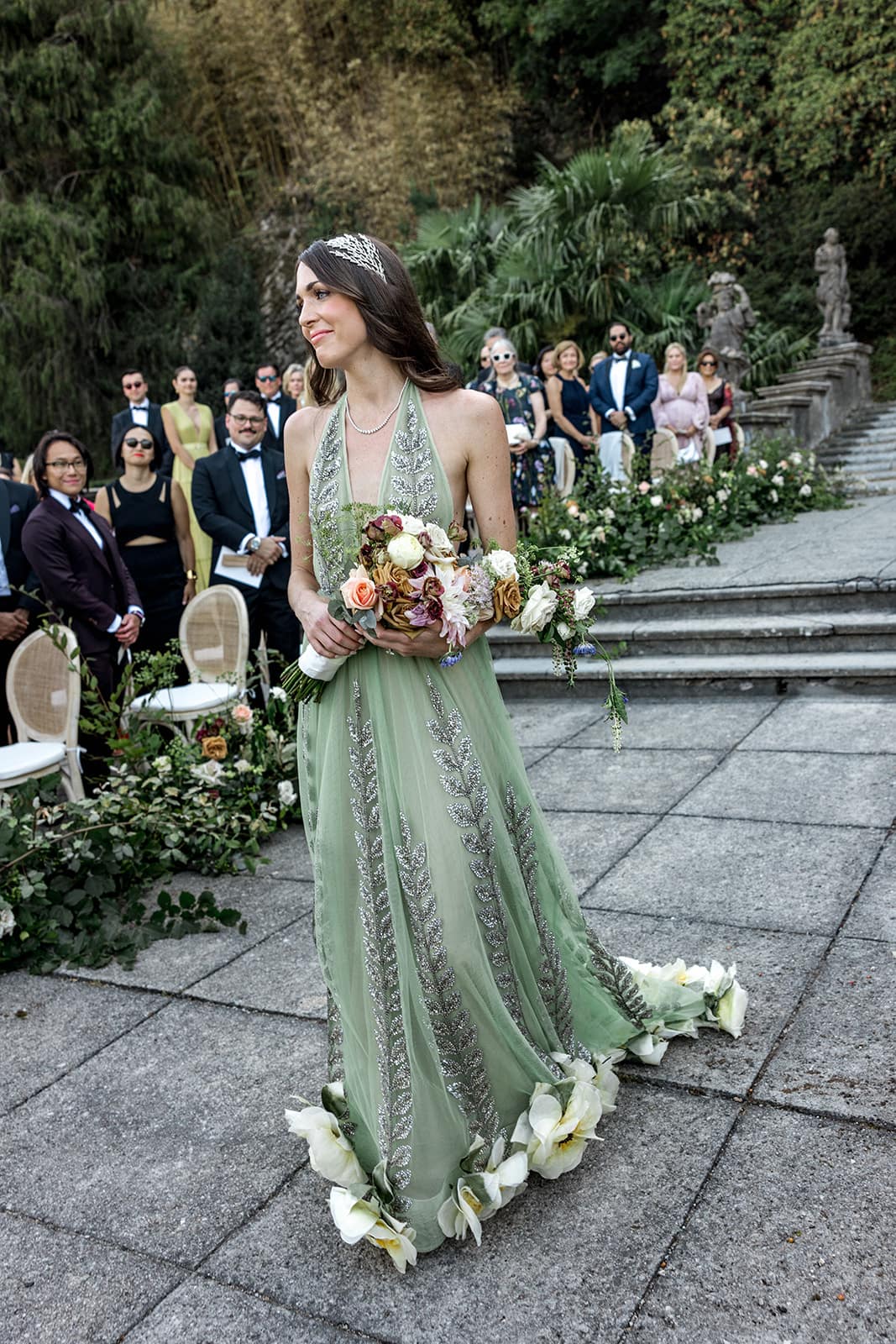 Bride walks down the ceremony aisle at a Villa Pizzo wedding