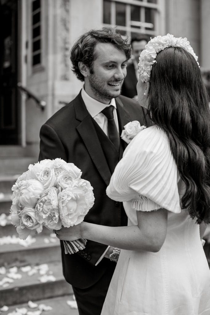 Groom looks at his bride after getting married at Chelsea Old Town Hall. 