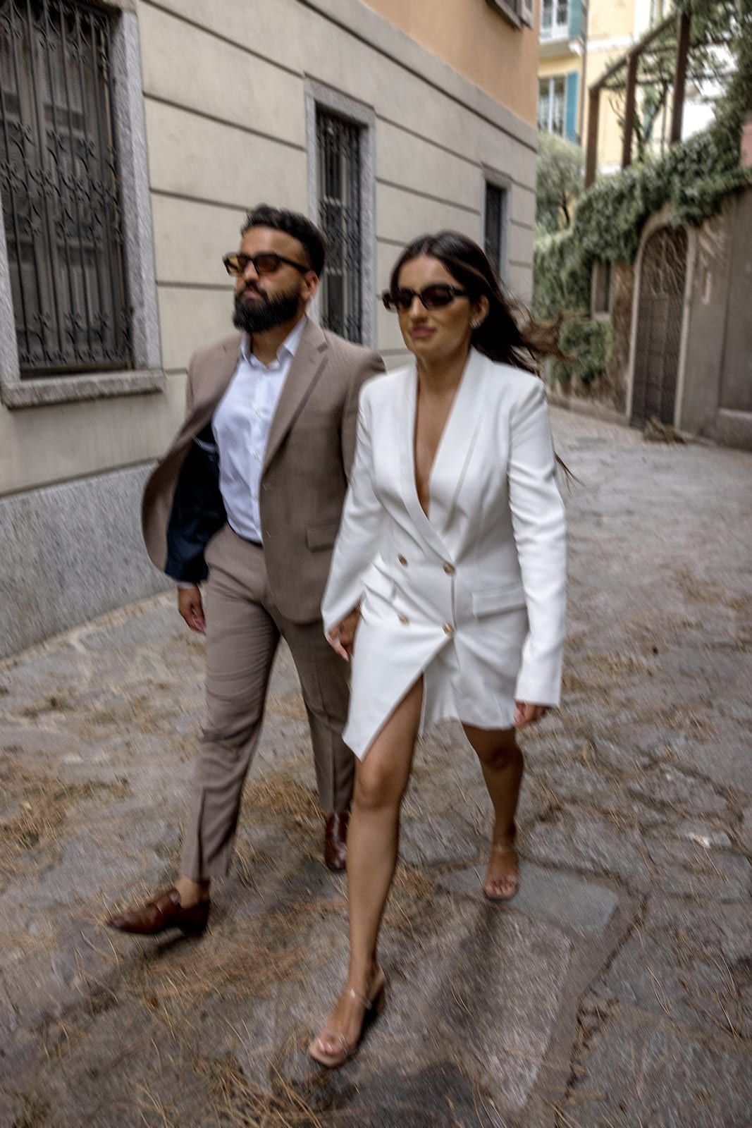 Couple walk through Varenna Italy