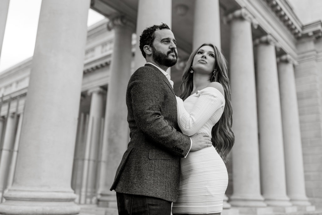 Man and woman embrace at Legion of Honor for engagement photos