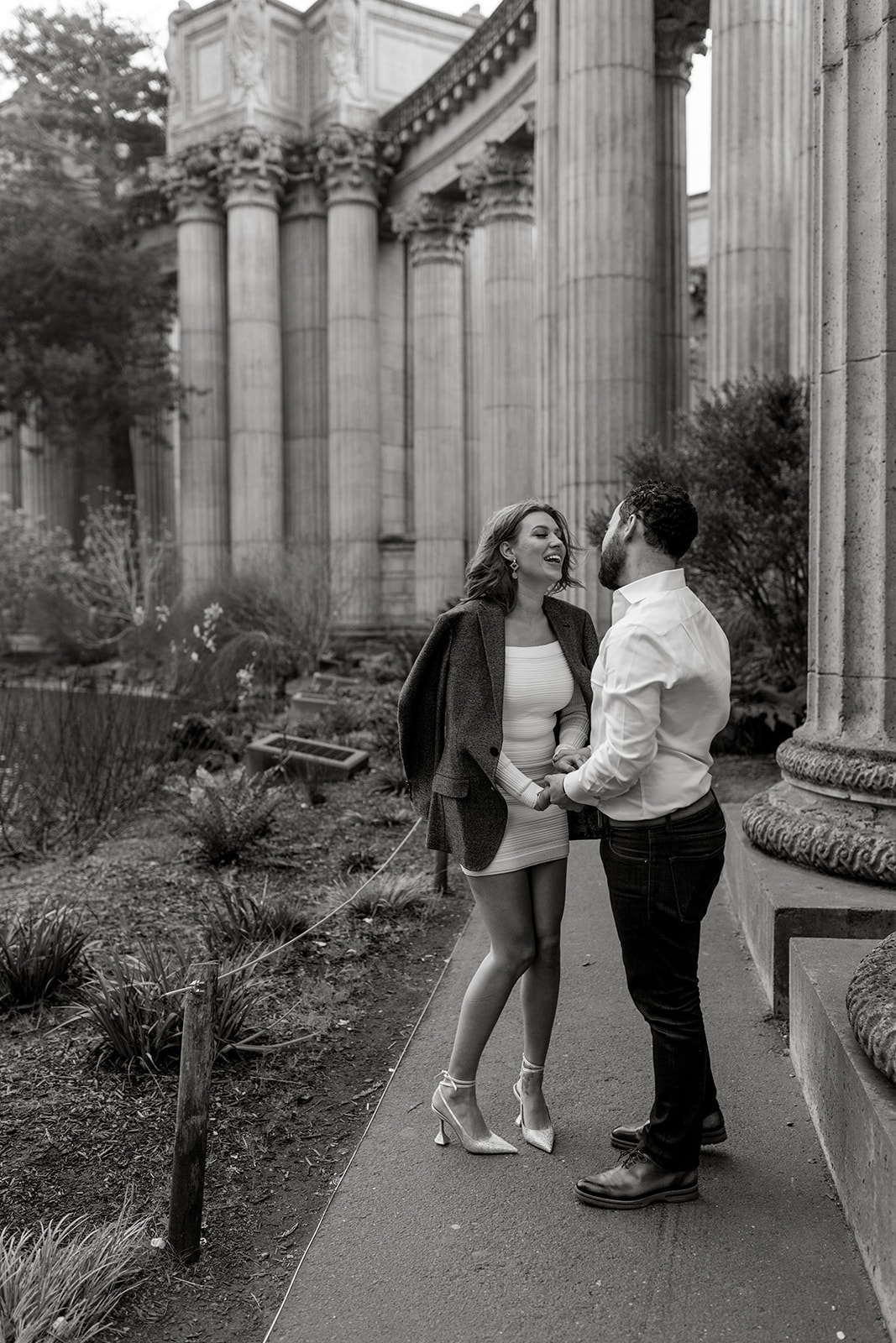 Man and woman talk to each other during engagement photos, bay area