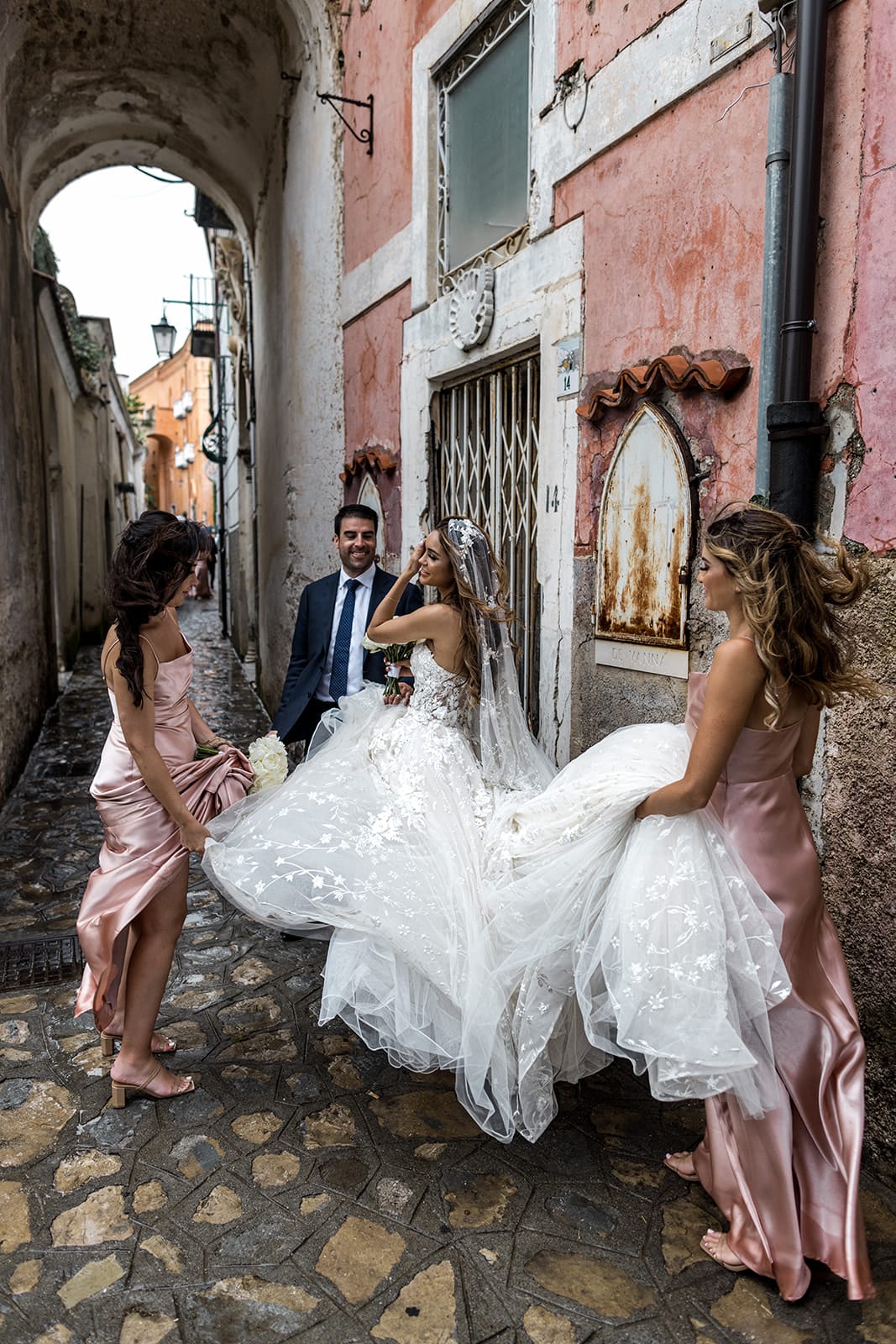 Bride, groom, bridesmaids walk streets of Ravello