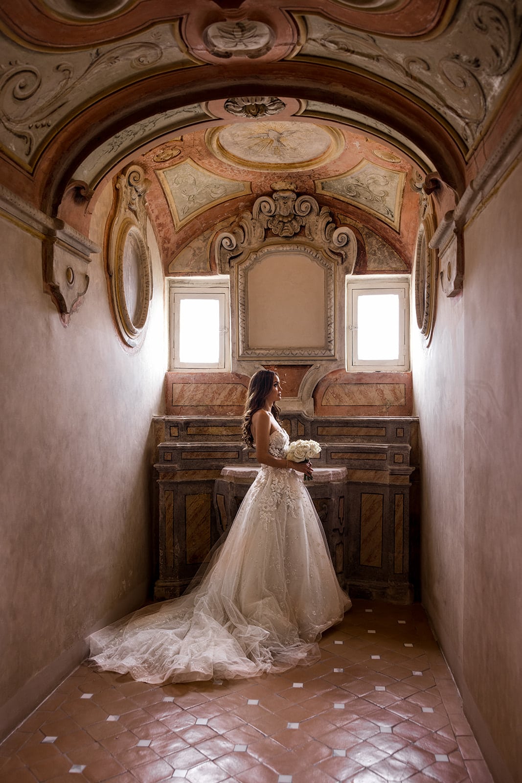 Bride stands in Duomo di Ravello before wedding ceremony