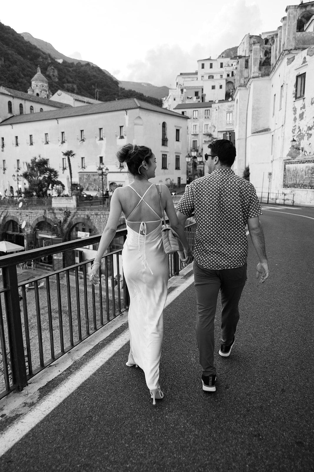 Man and woman walking through Ravello in Amalfi Coast Italy