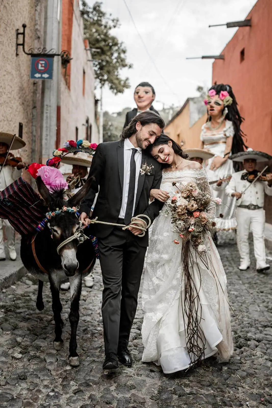 Bride and groom walk streets of San Miguel de Allende for callejoneada