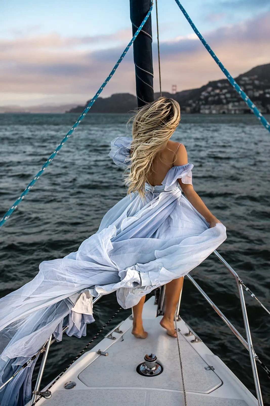 Woman on sailboat wears Leanne Marshall dress