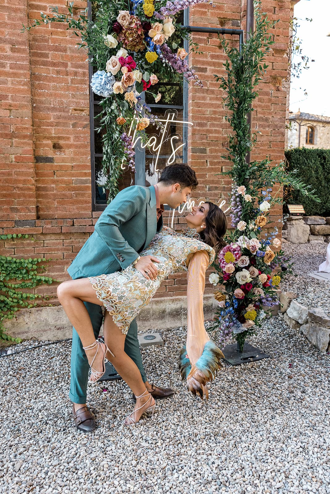 Man dips woman in kiss at wedding anniversary reception