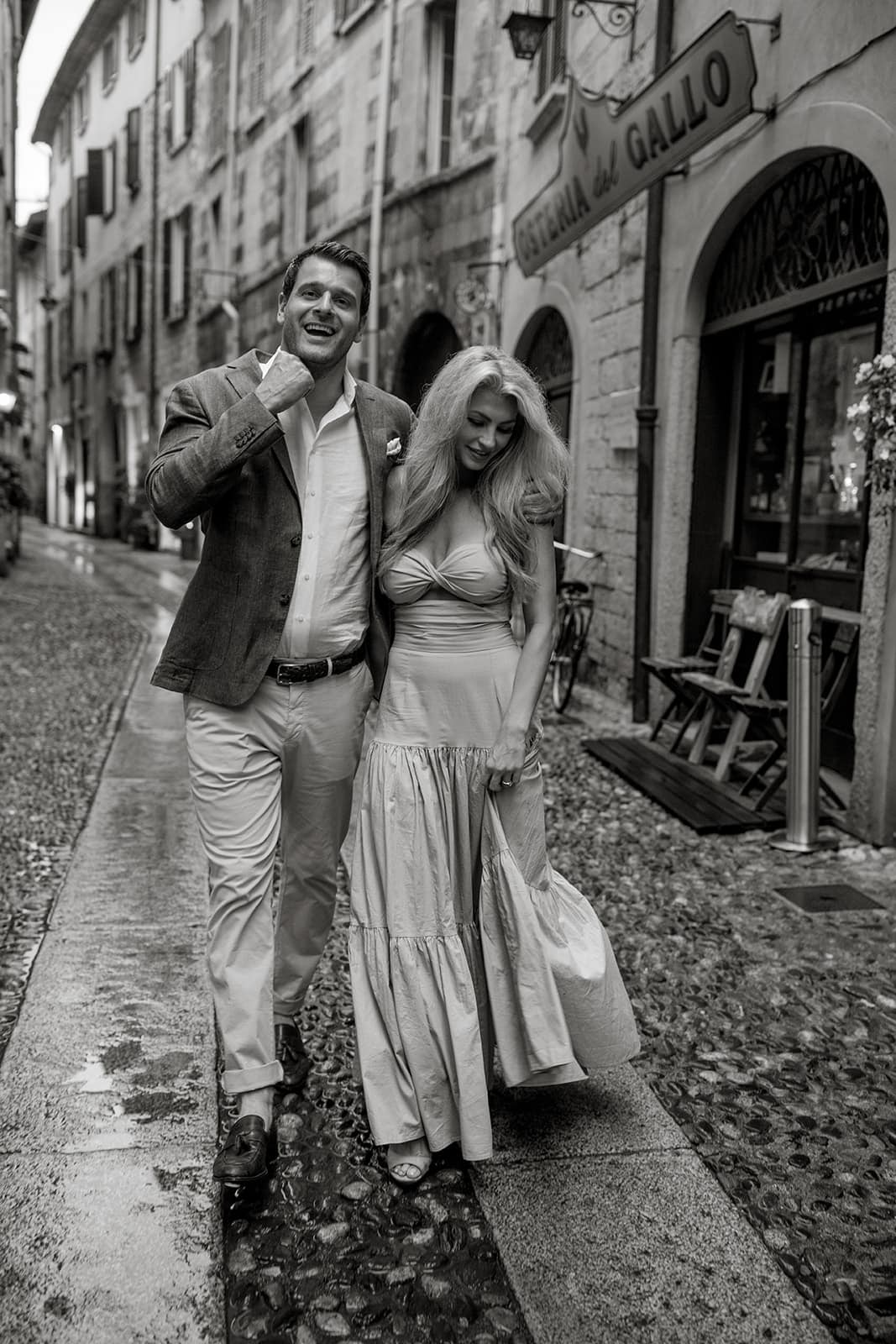 Couple take a romantic walk through streets of Varenna