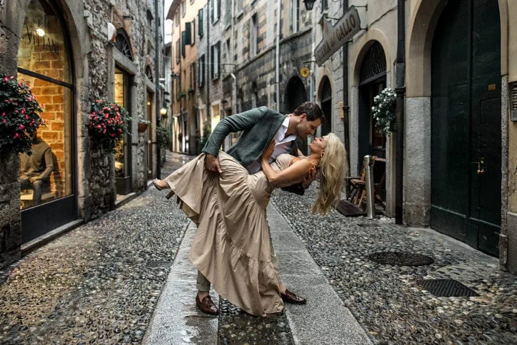 Man dips his fiancee for engagement photos in Lake Como