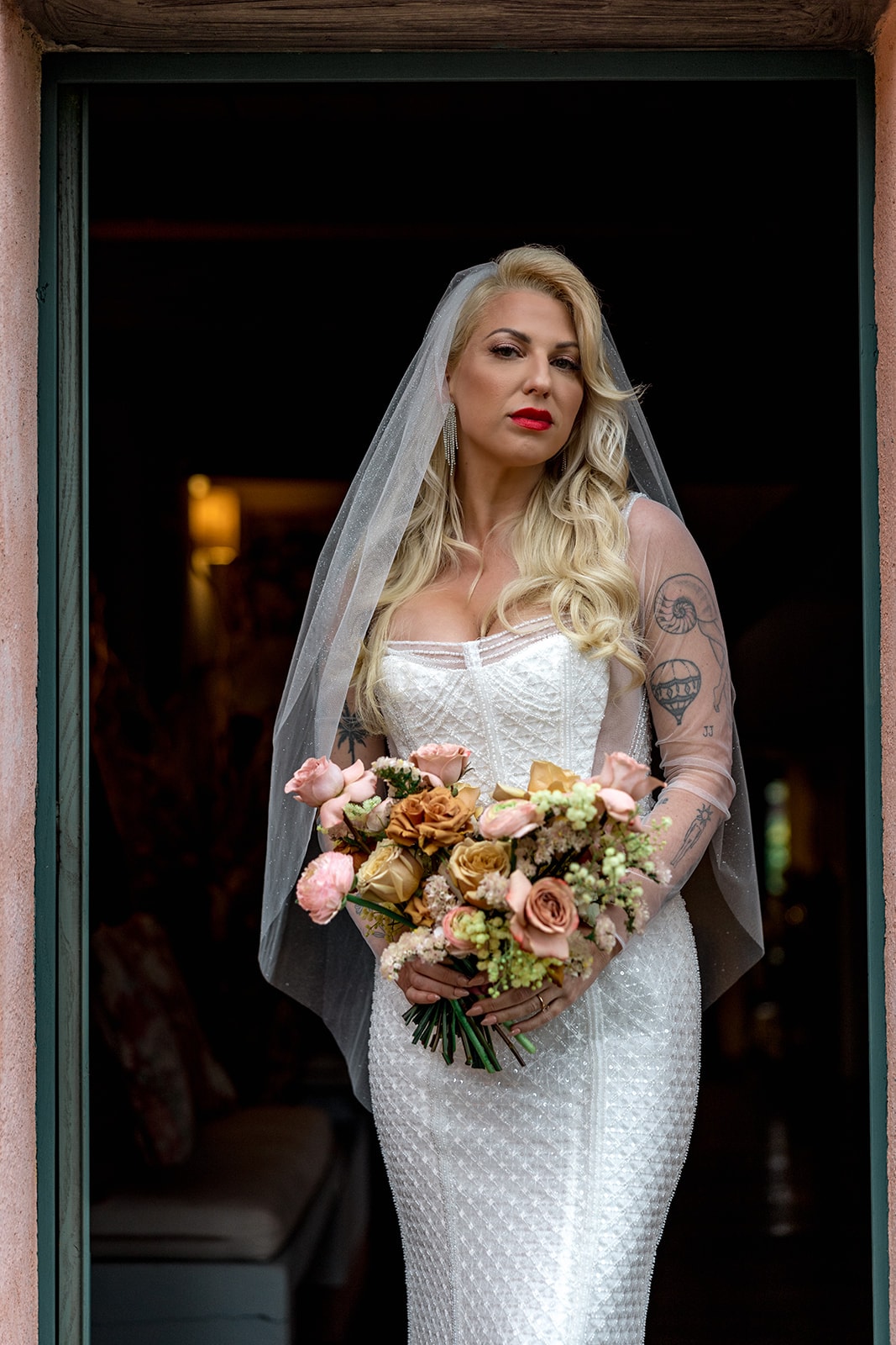 Vintage-inspired bride holds bridal bouquet