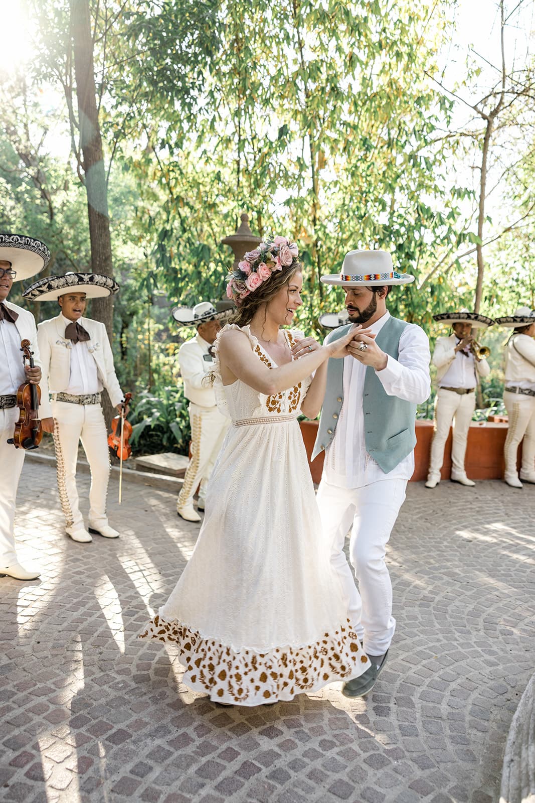 Bride and groom dance during traditional callejoneada in San Miguel de Allende