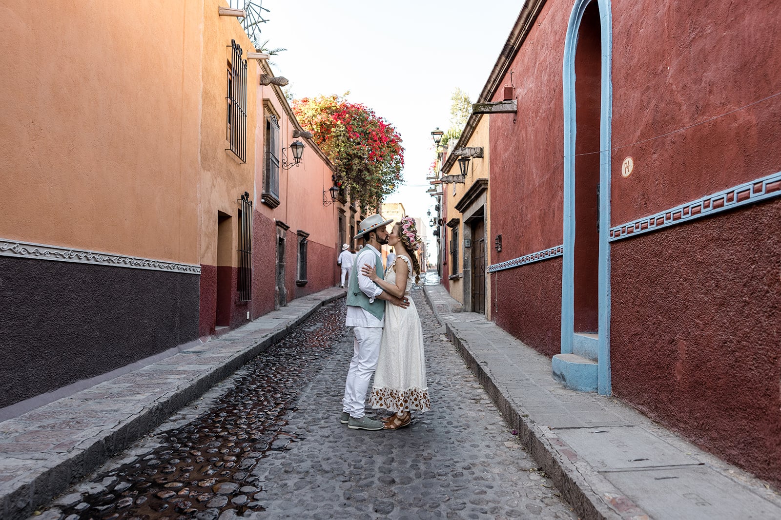 Bride and groom walk streets of Mexico