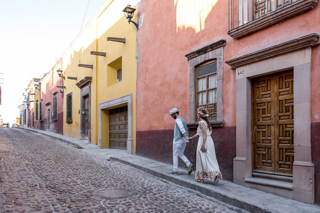 Bride and groom walk streets of San Miguel de Allende