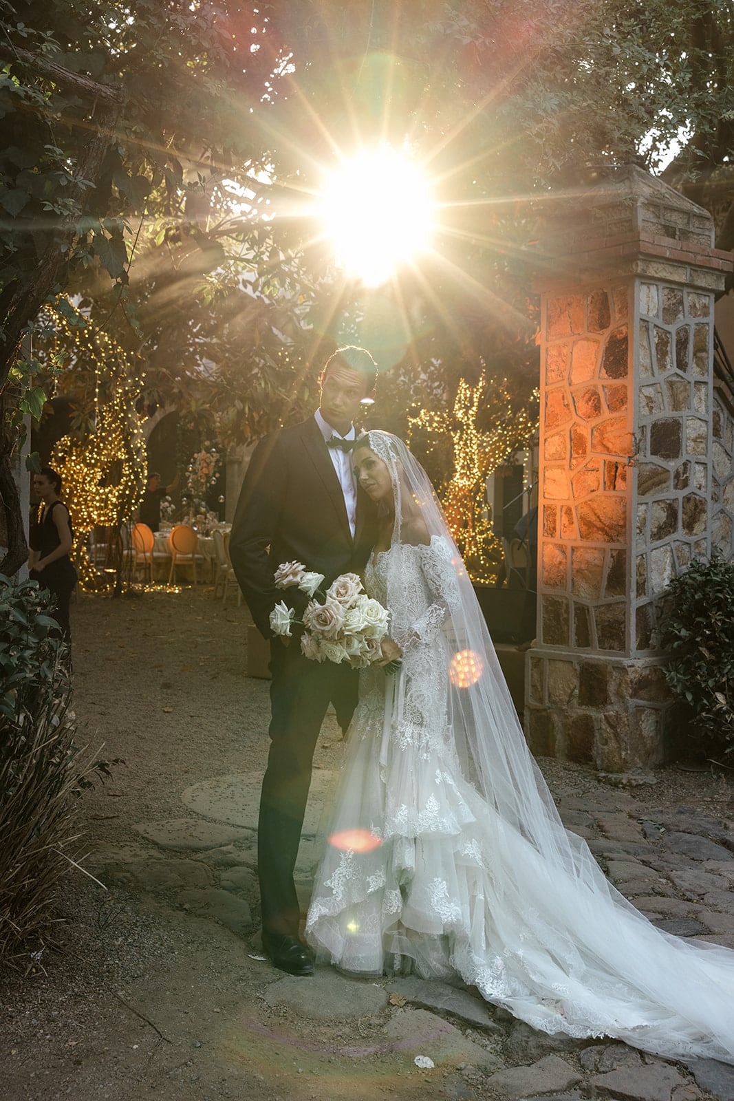 Bride and groom pose for sunset portraits at Sardinia wedding