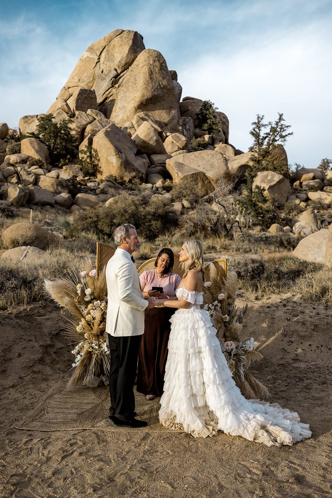 Bride and groom say vows to each other during wedding ceremony in Joshua Tree elopement