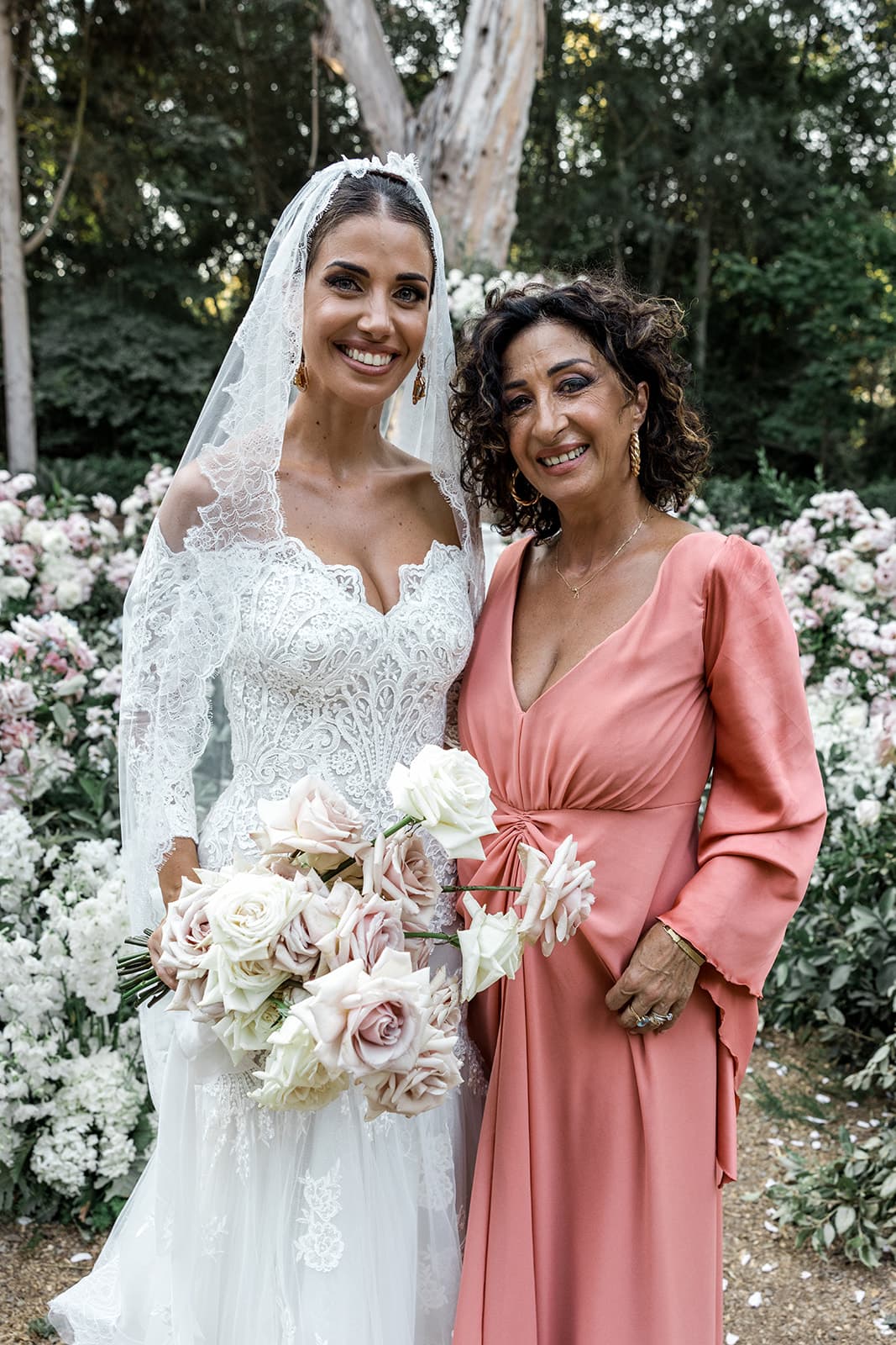 Bride stands with mother at Sardinia wedding ceremony