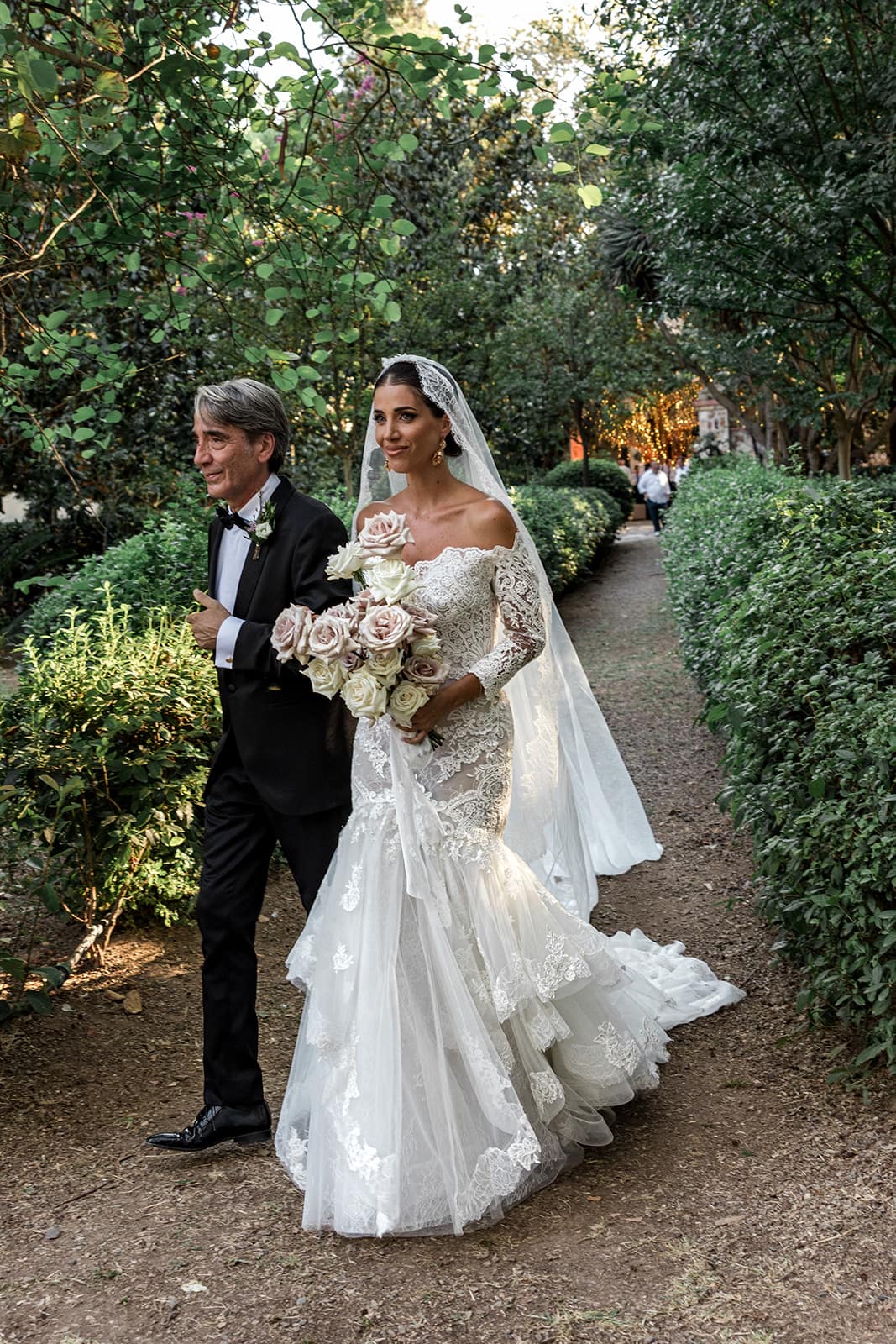 Bride and father walk down the aisle at Villa D'Orri