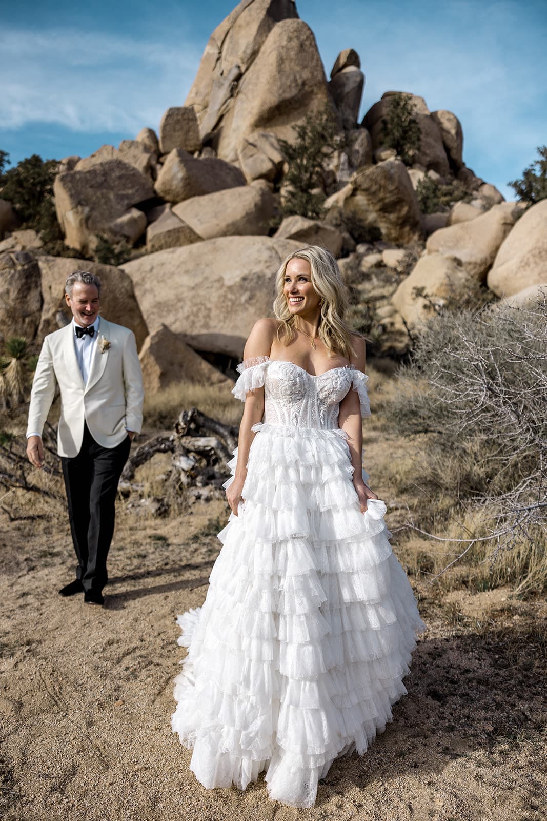 Bride walks in front of groom in Joshua Tree National Park