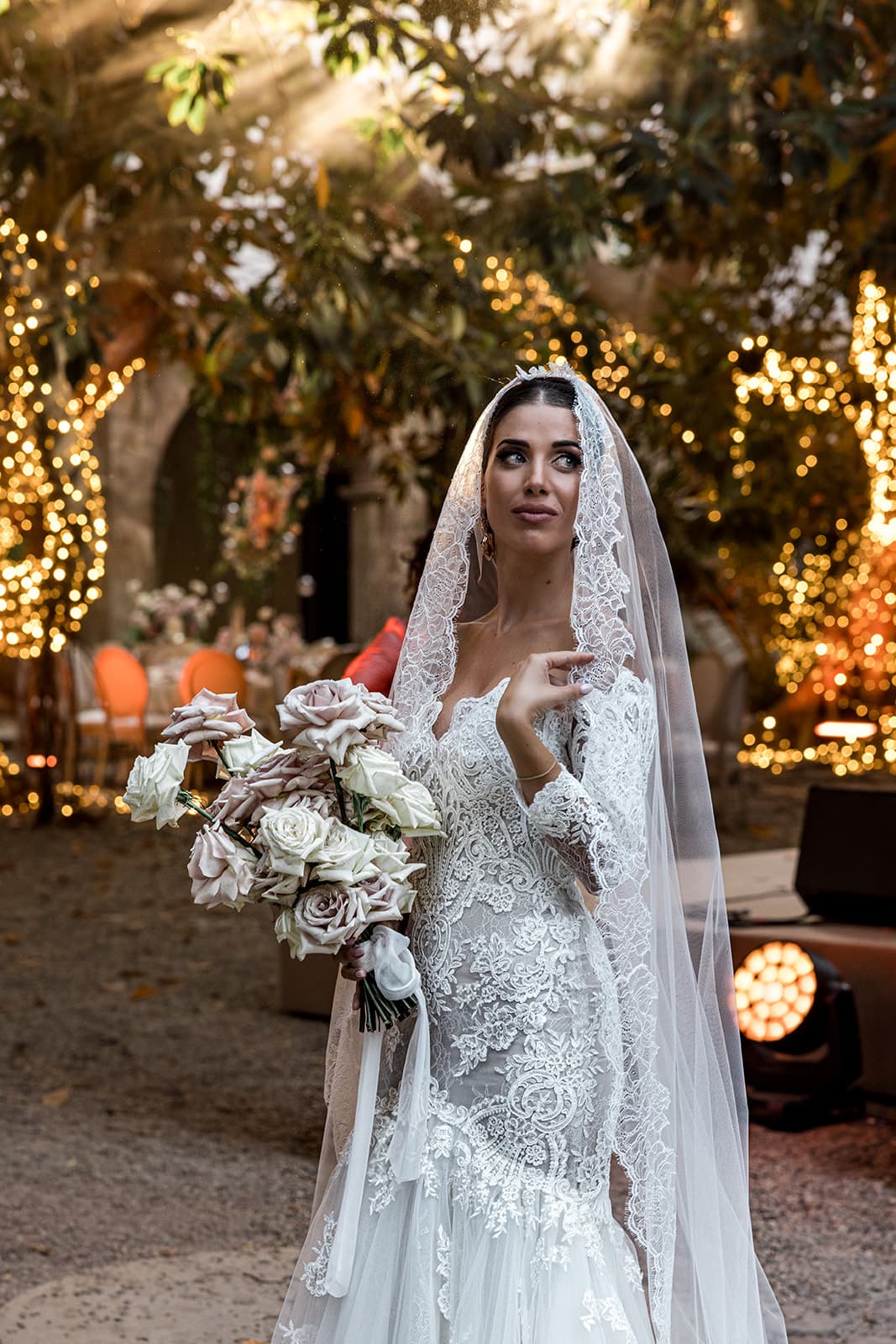 Bride wears classic bridal gown and veil at Sardinia wedding